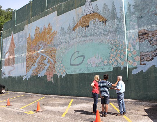 The Sentinel-Record/Richard Rasmussen BIG PLANS: Mary Neilson, left, artist Giuseppe Percivati and Ken Wheatley discuss the mural that will be painted on the south wall of a building in the 400 block of Central Avenue.