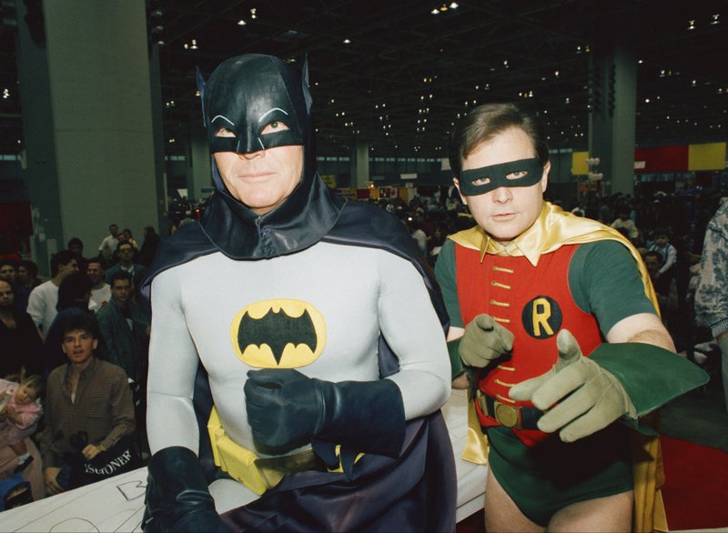 FILE - In this Sunday, Jan. 27, 1989 file photo, actors Adam West, left, and Burt Ward, dressed as their characters Batman and Robin, pose for a photo at the "World of Wheels" custom car show in Chicago. On Saturday, June 10, 2017, West’s family said the actor, who portrayed Batman in a 1960s TV series, has died at age 88. 