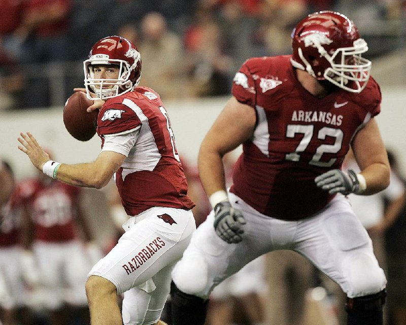 Arkansas quarterback Tyler Wilson (left) guided a furious second-half rally to help the Razorbacks rebound from an 18-point halftime deficit to beat Texas A&M 42-38 on Oct. 1, 2011. Wilson fi nished with a school-record 510 yards passing and three touchdowns.