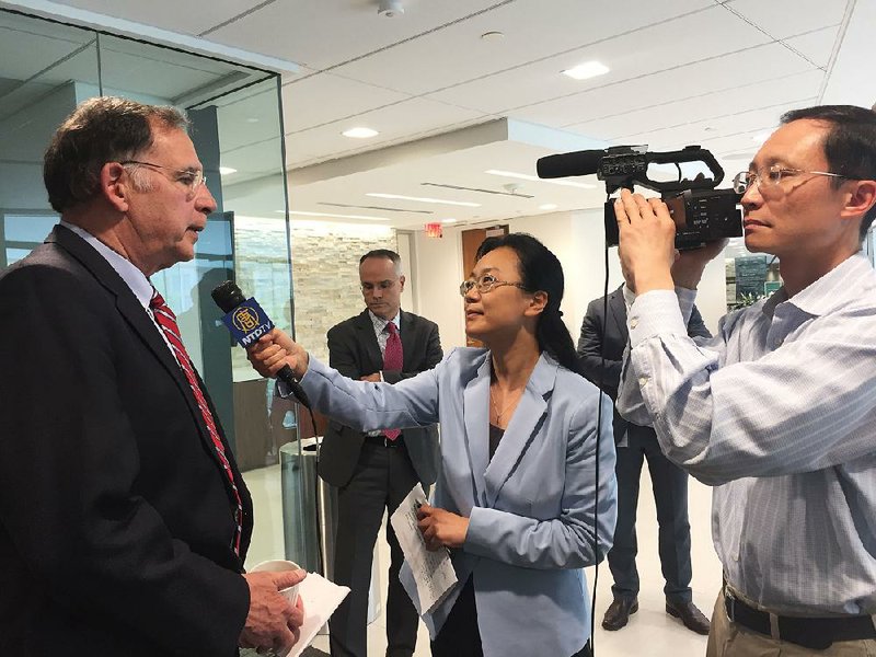 A news crew from the New York City-based New Tang Dynasty Television, a Chinese-language broadcaster, interviews U.S. Sen. John Boozman after his speech on infrastructure Thursday at the Hudson Institute, a conservative think tank in Washington