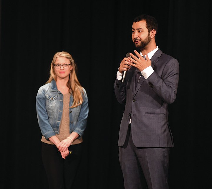 The Sentinel-Record/Mara Kuhn Lakeside High School alumni Natalie Larrison, left, and Mouaz Moustafa spoke May 25 at the high school auditorium about the Syrian Civil War and their work with the Syrian Emergency Task Force for fifth-grade students from Lakeside Middle School. Teachers for the fifth-grade class integrated information about the ongoing conflict into their lessons and activities during the final week of school. Moustafa helped found the SETF in 2012 and now serves as executive director. Larrison joined the organization in early 2016 as director of outreach.