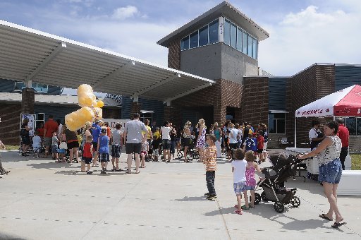 Visitors arrive Wednesday, June 20, 2012, at Willowbrook Elementary School and Bright Field Middle School in Bentonville. The Bentonville School District has arranged to sell 40 acres at the northwest corner of Southwest Wentworth Avenue and Southwest Bright Road, just west of the schools, to a home-building company for $1.6 million.
