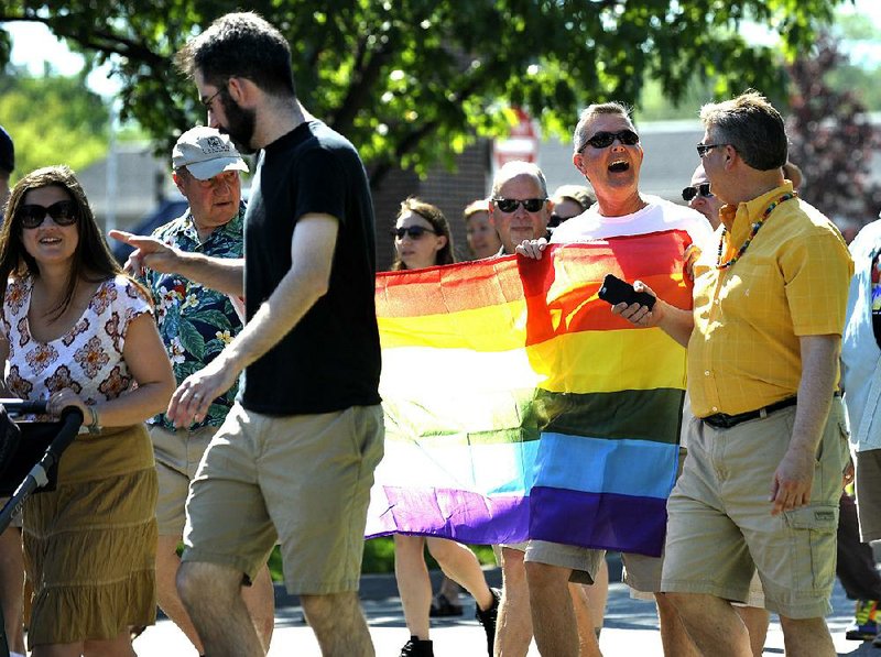 Supporters of the rights of lesbian, gay, bisexual and transgender Americans participate in the first-ever Grosse Pointe Pride March in Michigan on Sunday morning in conjunction with National Pride Day.