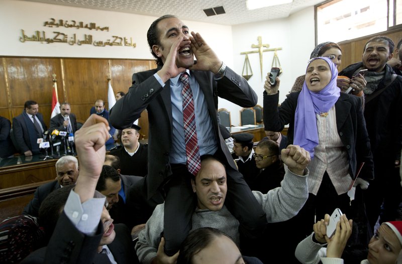 In this Jan. 16, 2017 file photo, prominent rights lawyer Malek Adly, center, shouts slogans after the Supreme Administrative Court said that two islands, Sanafir and Tiran, are Egyptian, debunking the government's claim that they belong to Saudi Arabia, in Cairo, Egypt. On Sunday, June 11, 2017, after a raucous start, an Egyptian parliamentary committee began reviewing a disputed 2016 agreement to hand control over two Red Sea islands to Saudi Arabia.