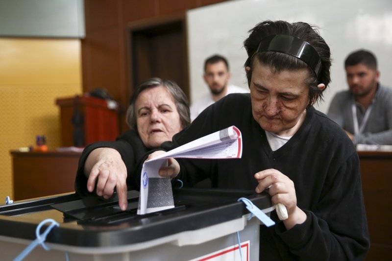 Kosovo voters cast their ballots during the early parliamentary elections Pristina, Kosovo, Sunday, June 11, 2017. Voters in Kosovo have started to cast their ballots in an early general election for the new 120-seat parliament.