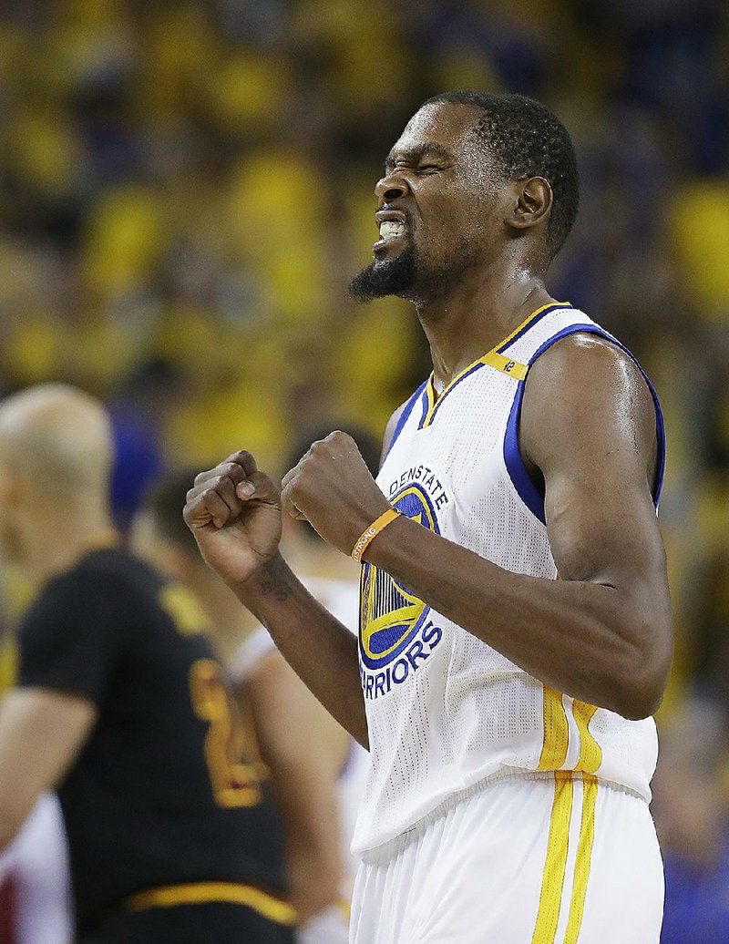 Golden State Warriors forward Kevin Durant reacts in the closing minutes of the Warriors’ victory over the Cleveland Cavaliers in Game 5 of the NBA Finals on Monday night. Durant had 39 points, including  5 three-pointers, and 7 rebounds as the Warriors clinched their second NBA title in three seasons.