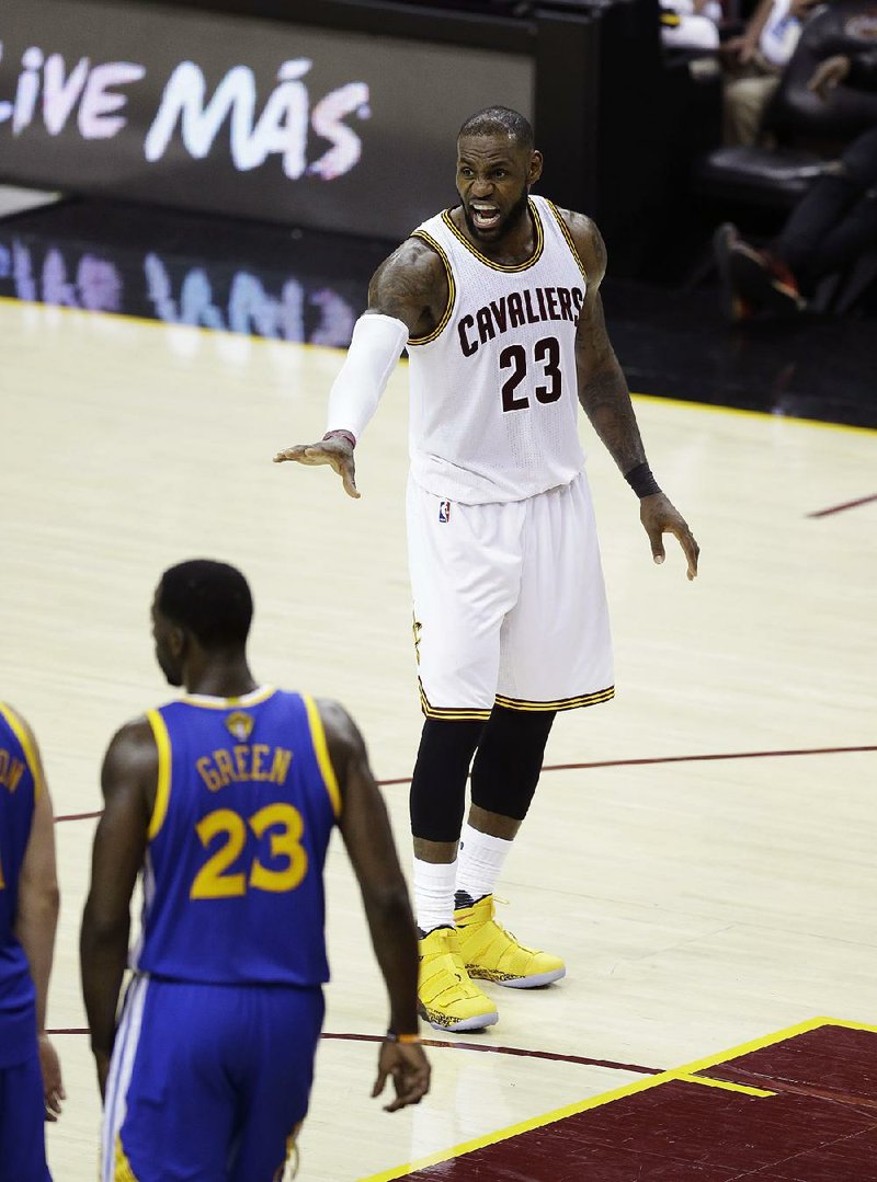 Cleveland Cavaliers forward LeBron James (23) gives instructions during play against the Golden State Warriors in the second half of Game 4 of basketball's NBA Finals in Cleveland, Friday, June 9, 2017. 