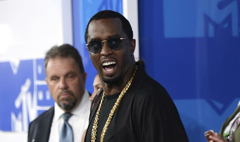 FILE - In this  Aug. 28, 2016, file photo, Sean "Diddy" Combs arrives at the MTV Video Music Awards at Madison Square Garden in New York. On June 12, 2017, Forbes named Combs the top earner its list of the 100 highest paid celebrities. 