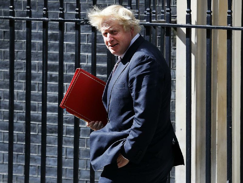 British Foreign Secretary Boris Johnson leaves No. 10 Downing St. on Monday after a Cabinet meeting in London.
