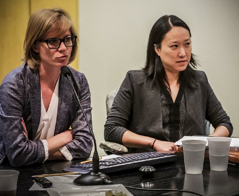 Juliane Wolf (left) and Angela Peckham, both with the architectural firm Studio Gang, discuss their ideas for renovation of the Arkansas Arts Center on Monday.