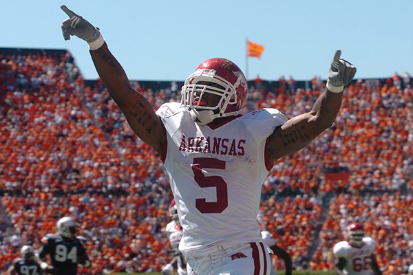 Arkansas running back Darren McFadden celebrates after scoring a 63-yard touchdown during a game against Auburn on Saturday, Oct. 7, 2006, in Auburn, Ala. The Razorbacks beat the No. 2 Tigers 27-10.