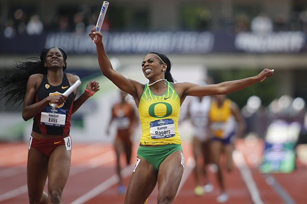 Oregon's Raevyn Rogers celebrates as she crosses the finish line ahead of Southern California's Kendall Ellis to win the women's 4x400 meters relay on the final day of the NCAA outdoor college track and field championships in Eugene, Ore., Saturday, June 10, 2017. (AP Photo/Timothy J. Gonzalez)

