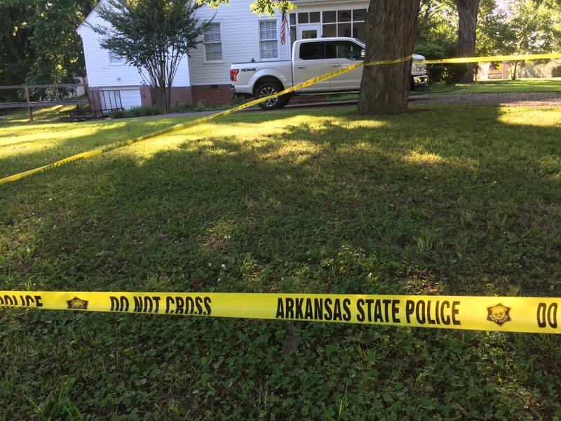 Arkansas State Police crime scene tape blocks off a yard near Remmel Park in Newport Tuesday morning.