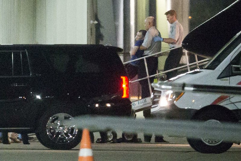 Otto Warmbier, a 22-year-old college student released by North Korea after being detained for 17 months, is carried off an airplane Tuesday night at Lunken Airport in Cincinnati.