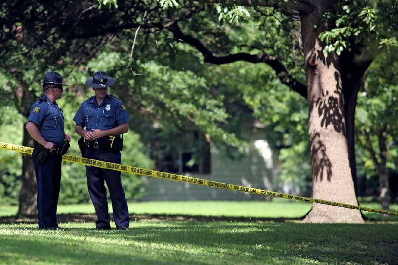 FILE — State troopers stand watch on June 13, 2017 at Remmel Park in Newport the day after Newport police Lt. Patrick Weatherford was fatally shot.