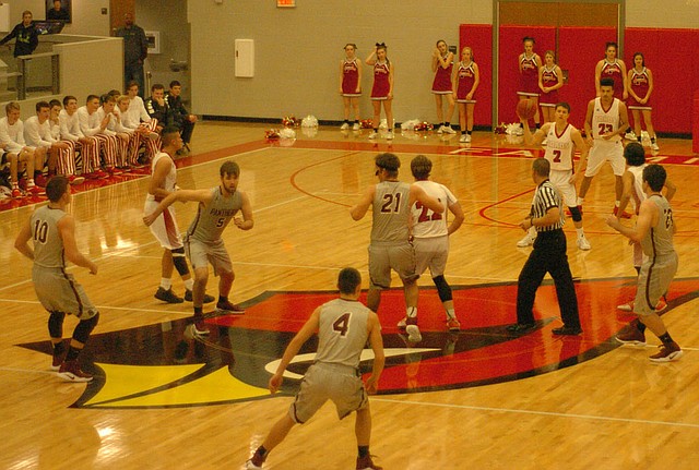 MARK HUMPHREY ENTERPRISE-LEADER Farmington&#8217;s Matthew Wilson (No. 2) secures possession after teammate Cade Fenton won the opening jump ball versus Siloam Springs. Wilson wasted little time in the backcourt. He dribbled straight up the middle and crossed halfcourt, then busted a 3-pointer en route to a school-record 49 points, an effort he would surpass with 50 points Jan. 13 against Clarksville.