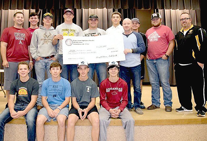 Submitted photo The 2017 Prairie Grove baseball team presented a check in the amount of $4,000 to PGHS assistant principal Joey Sorters May 30. The check represented funds raised during the first annual Jarren Sorters Memorial Baseball Tournament hosted by Prairie Grove during spring break. The entire team wore No. 27, Jarren Sorters&#8217; number on the back of their baseball caps throughout the season. Jarren Sorters was the son of Joey and Donna Sorters, of Prairie Grove. He passed Aug. 11, 2016, after battling childhood cancer .