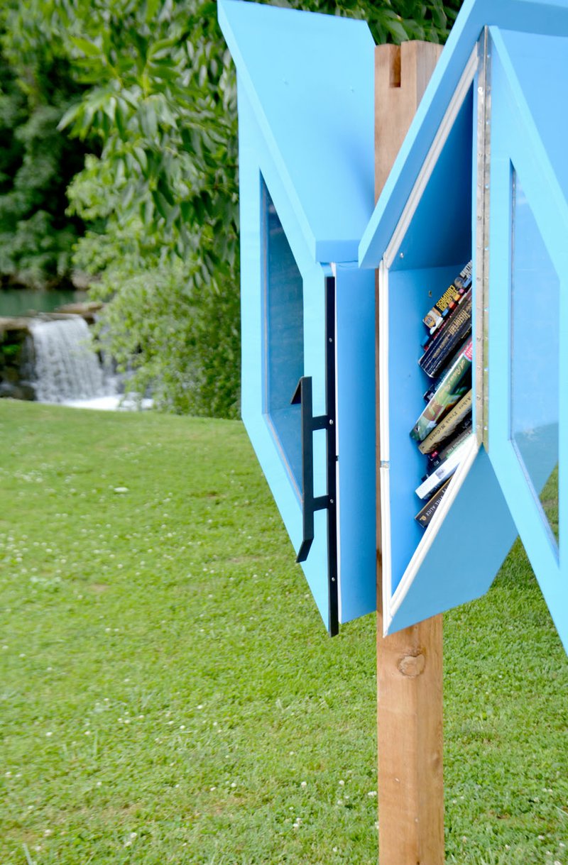 Michael Burchfiel/Herald-Leader A pair of Librarrows were unveiled late last week. The miniature libraries are a place to take a new book and leave behind one that you have already read and enjoyed.