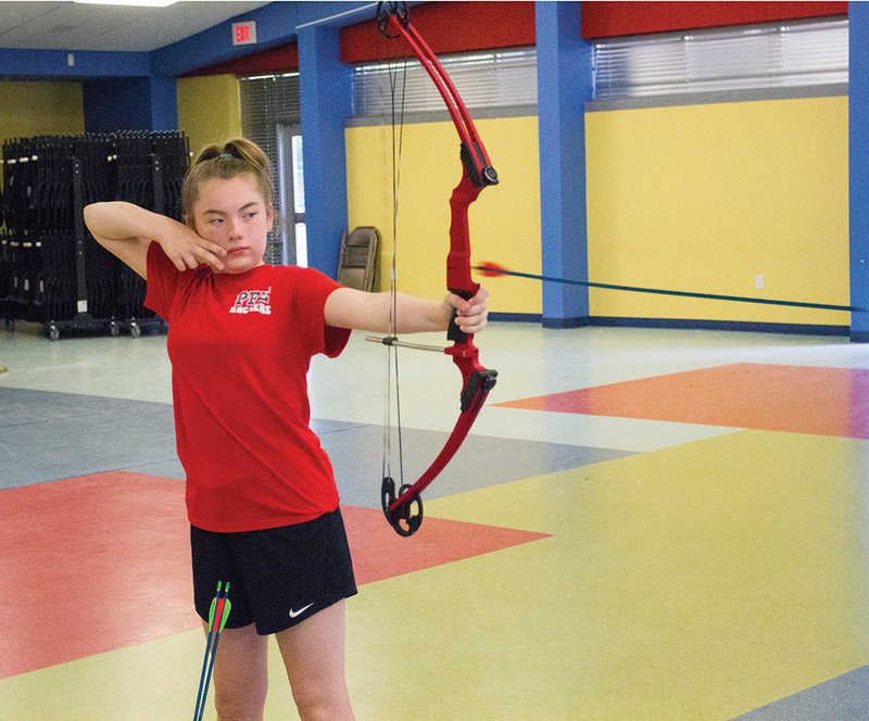 Bailey Mason of Maumelle practices archery at Pine Forrest Elementary School. Mason, who recently completed the fifth grade, finished fourth in the National Archery in School national championships in Louisville, Ky., with a score of 287 out of a possible 300 in the elementary division. Mason will take part in the world championships July 21 and 22 in Orlando, Fla.