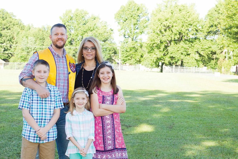 Clockwise from top, Paul Richards poses with his wife, Nikki; daughters Hailey, 9, and Zoey, 6; and son, Hunter, 10, outside of Jacksonville Wastewater Utility where he works as the engineer and construction manager. Richards will become the president of the Jacksonville Lions Club on July 1, and said his family gives him the strength to be the best that he can be.