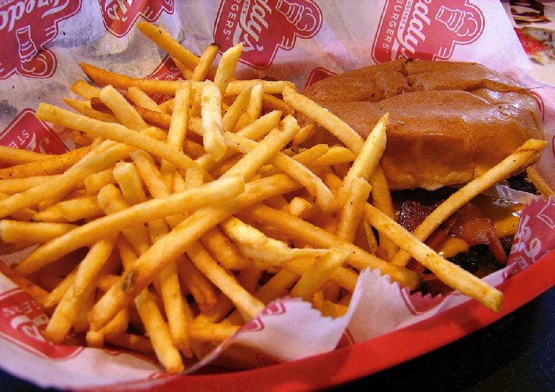 The single bacon cheese steakburger with fries at Freddy’s Frozen Custard & Steakburgers in North Little Rock comes in a red plastic basket. 