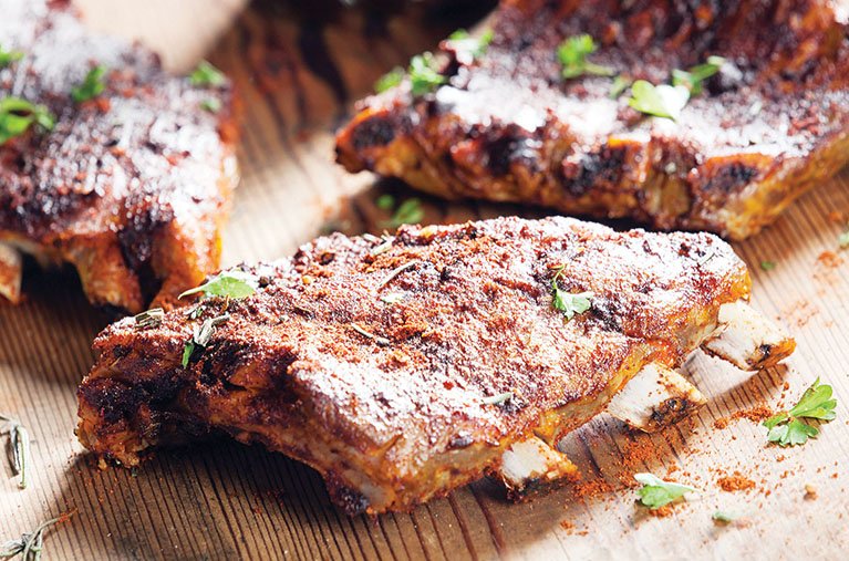 For these barbecued park ribs start with a sweet-and-spicy rub, and serve a simple sauce for dipping.