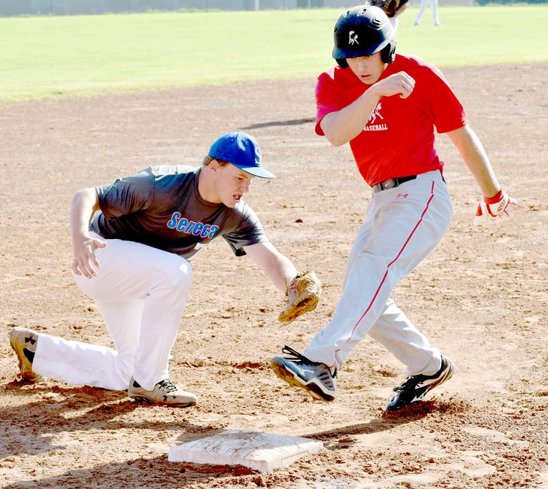 Photo by Rick Peck McDonald County&#8217;s Ty Shaver tries to sneak into third base before being tagged out during McDonald County&#8217;s 2-1 win on June 7 at McDonald County High School.