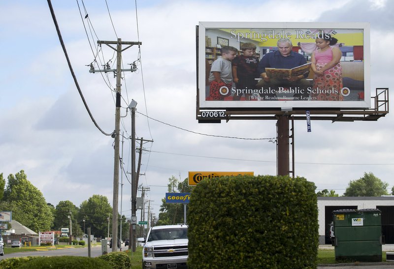NWA Democrat-Gazette/JASON IVESTER Billboard with Springdale Mayor Doug Sprouse promoting Springdale Public Schools on display on South Pleasant Street in Springdale.