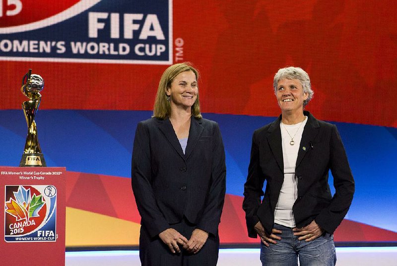 U.S. coach Jill Ellis (left) received a $90,000 bonus for coaching the women’s national soccer team to the 2015 World Cup title. Men’s coach Jurgen Klinsmann, though, received $500,000 in bonuses for leading his team to the
second round of the 2014 event.