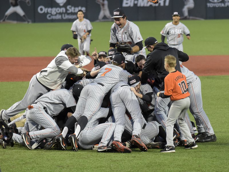 The Oregon State baseball team celebrates after defeating Vanderbilt 9-2 in an NCAA tournament super regional game Saturday, June 10, 2017, in Corvallis, Ore., to advance to the College World Series.