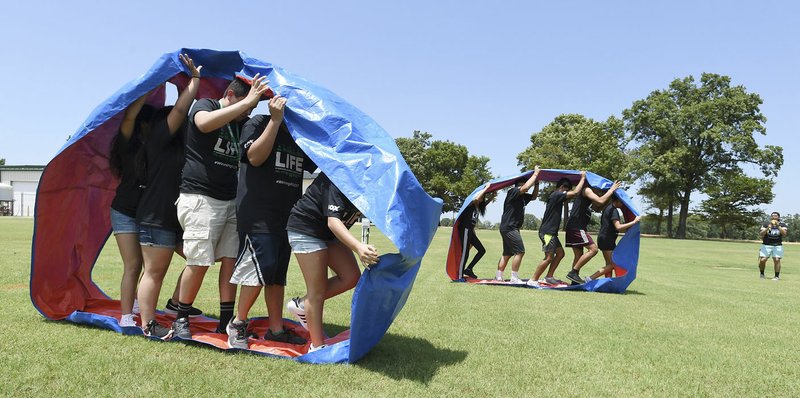 NWA Democrat-Gazette/J.T. WAMPLER Teams compete Thursday during LIFE Olympics at Northwest Arkansas Community College’s LIFE program in Bentonville. Students in the program come from the Bentonville, Fayetteville, Gentry, Pea Ridge, Rogers and Springdale districts. The three-day program informs Northwest Arkansas high school students about the process of getting into and being successful in college.