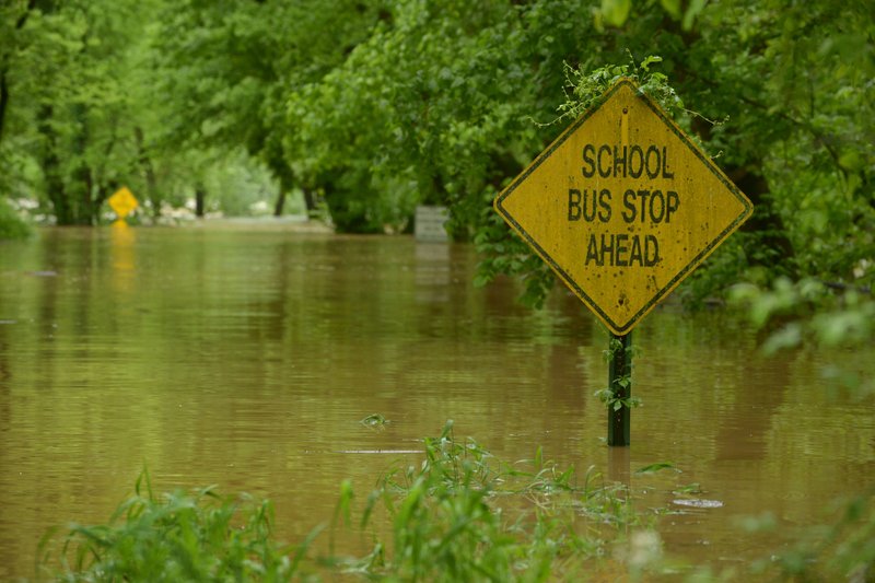 NWA Democrat-Gazette/BEN GOFF @NWABENGOFF Water crests over War Eagle Road Sunday, April 30, 2017, near War Eagle Mill in Benton County East of Rogers.