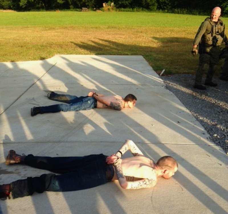 This photo provided by the Tennessee Bureau of Investigation shows the arrest of the two Georgia fugitives Donnie Rowe, top, and Ricky Dubose, bottom, in Christiana, Tenn., on Thursday, June 15, 2017. 