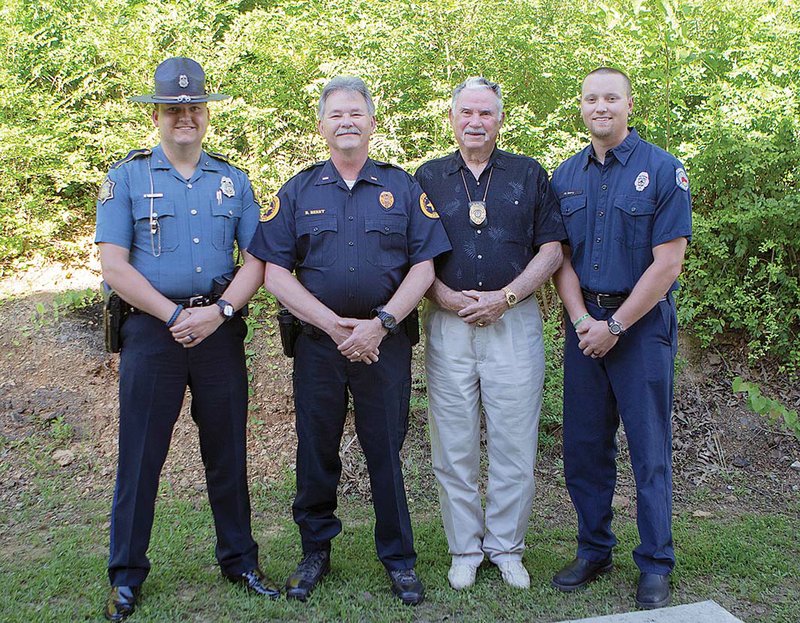 Chuck Berry, second from right, is a retired Conway police officer, and his son, Lt. Bob Berry, second from left, followed in his father’s footsteps and will retire this month after 28 years of service. Bob’s son Josh, far left, is a corporal with the Arkansas State Police, and Bob’s son Tyler, far right, is a Conway firefighter. Bob Berry also attended the FBI Academy in 2002. A retirement reception for him is scheduled for 2 p.m. Tuesday on the second floor of the Conway Police Department.