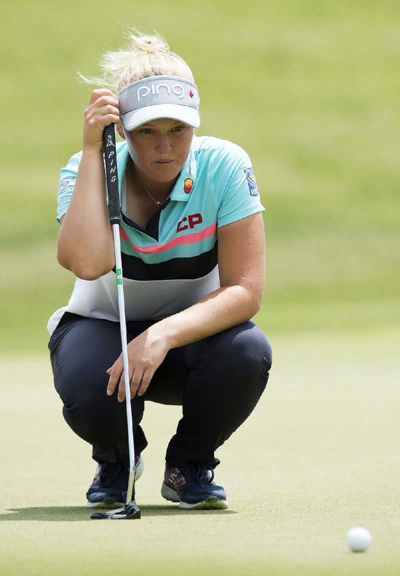 Canadian Brooke Henderson bogeyed the final two holes, but still managed to hold a two-stroke lead over three others after two rounds of the Meijer LPGA Classic at Grand Rapids, Mich., on Friday.