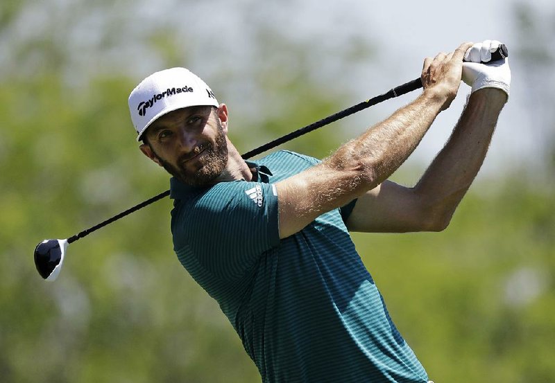 Dustin Johnson tees off on the fifth hole during the second round of the Memorial golf tournament, Friday, June 2, 2017, in Dublin, Ohio. 