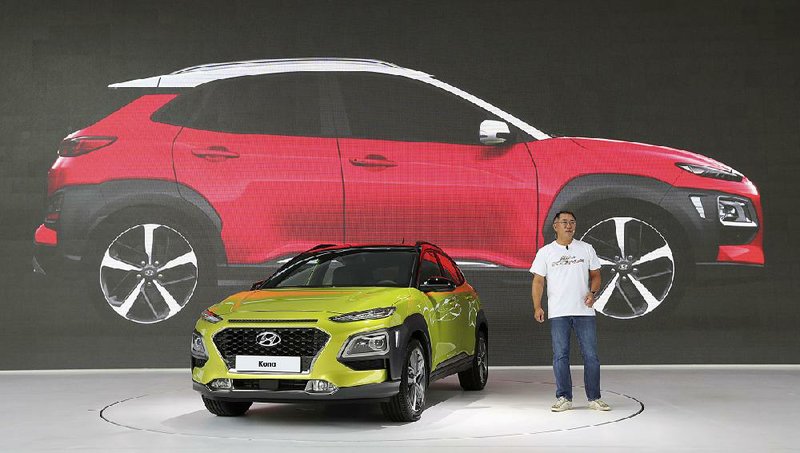 Chung Eui Sun, vice chairman of Hyundai Motor Co., speaks next to a new SUV Kona during its world premiere in Goyang, South Korea, earlier this month. 