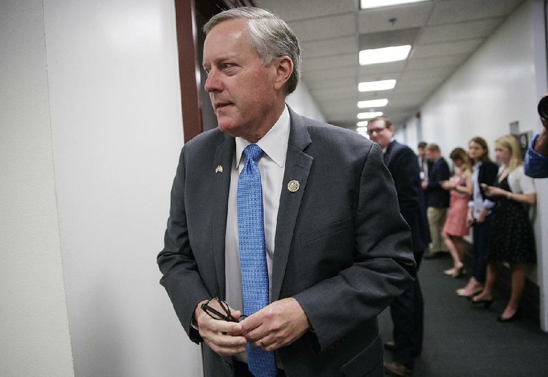 Rep. Mark Meadows, R-N.C. and chairman of the House Freedom Caucus, walks on Capitol Hill in March.