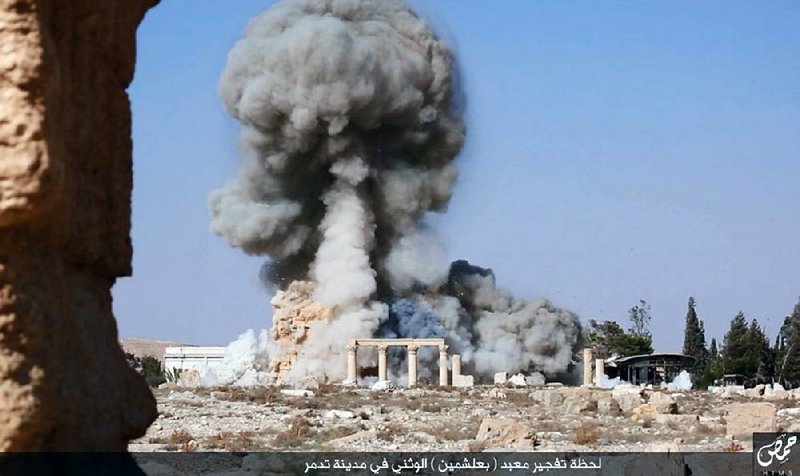 An explosion damages the 2,000-year-old Temple of Baalshamin in Palmyra, Syria, in this photo posted on an Islamic State social media site in August 2015.
