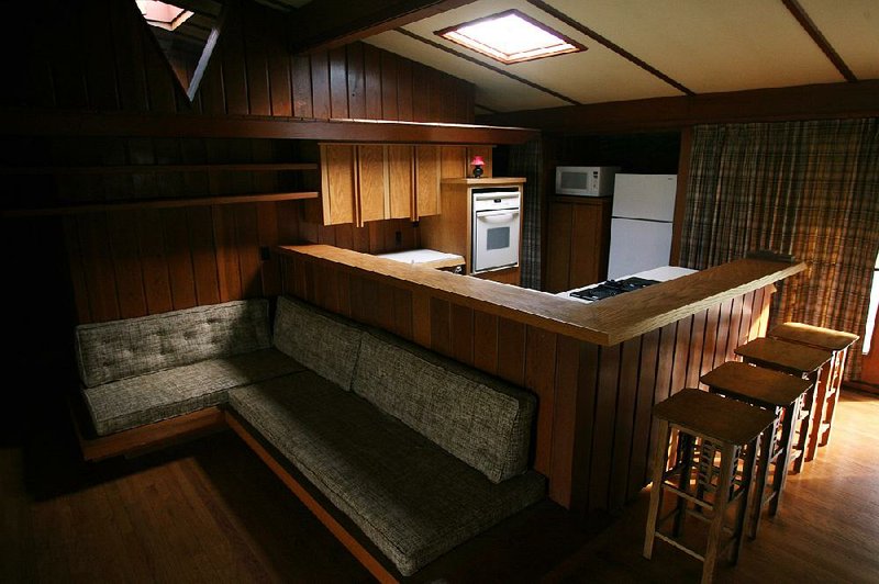 This photo shows the 1957 home’s living room and kitchen area before this month’s blaze destroyed it. 