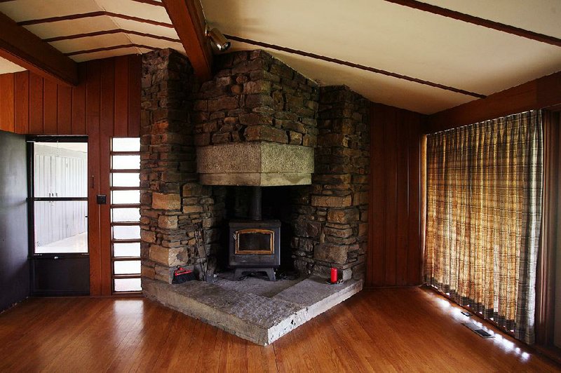 This fireplace is one of the few things that can be salvaged after a fire recently engulfed a home in Fayetteville that was designed by architect E. Fay Jones and was once lived in by former President Bill Clinton. 