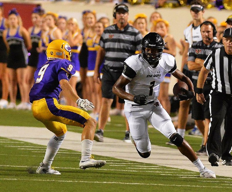 After missing the first game of his sophomore season, Jonathan Adams (1) ended his career with Jonesboro by catching 139 passes for 2,633 yards and 45 touchdowns. He also was a standout basketball player and long jumper for the Hurricane. 