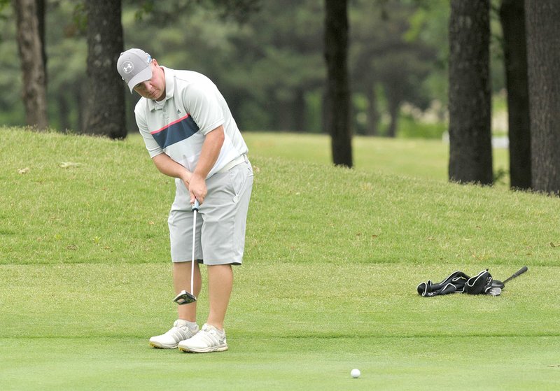 NWA Democrat-Gazette/BEN GOFF @NWABENGOFF Matt Willmott putts on the 18th green Saturday during the second round of the Chick-A-Tee golf tournament at Springdale Country Club.