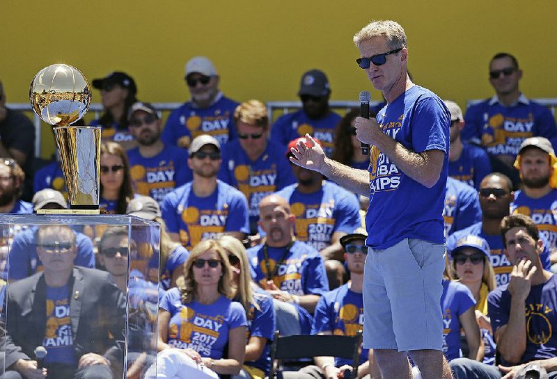 Golden State Warriors coach Steve Kerr speaks during the NBA basketball team's championship rally Thursday, June 15, 2017, in Oakland, Calif. Oakland is celebrating its second championship in the past three years. 