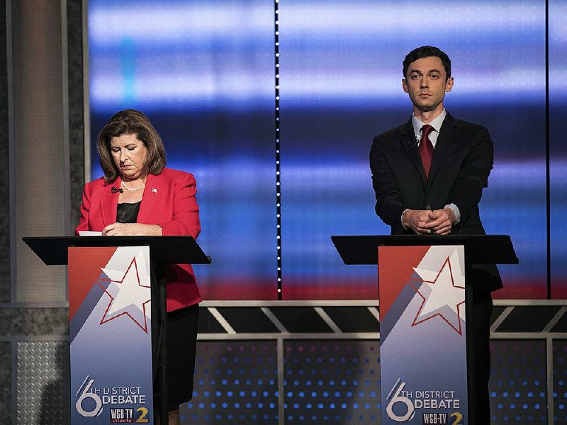 Candidates in Georgia’s 6th Congressional District race, Republican Karen Handel (left) and Democrat Jon Ossoff, prepare to debate in Atlanta earlier this month.