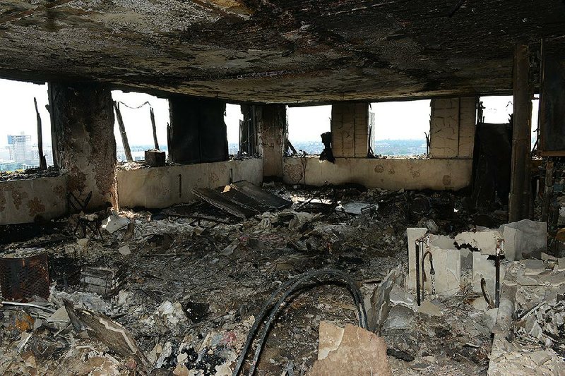 This photo released by the Metropolitan Police on Sunday shows an apartment in London’s Grenfell Tower after fire gutted the 24-story building Wednesday.