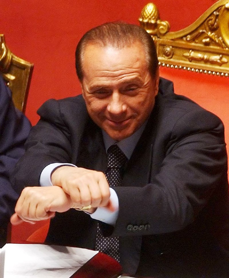 Italian Premier Silvio Berlusconi crosses his arms during a confidence vote at the Italian Senate, in Rome, Thursday, April 28, 2005.  
