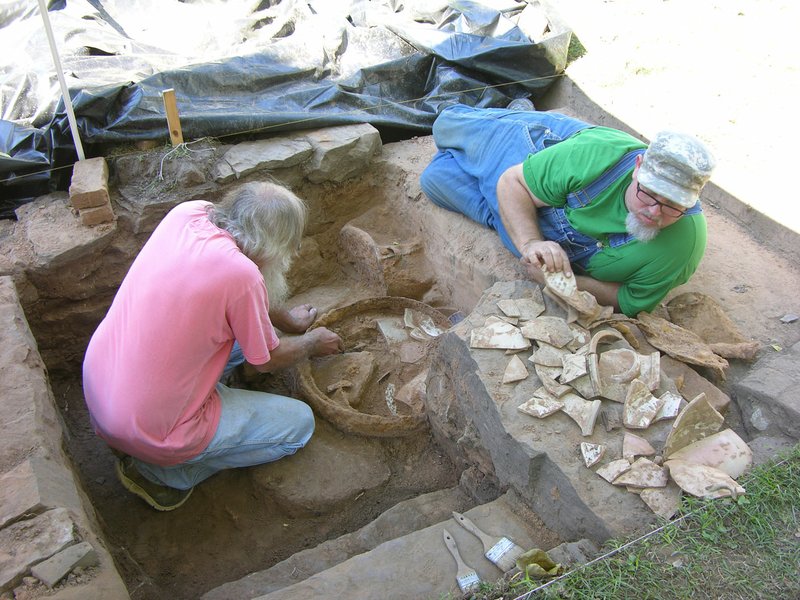 Arkansas Archaeological Survey Arkansas Archaeological Survey archaeologists Larry Porter, left, and Jared Pebworth excavate a cellar found recently behind the Wilhaf house as part of the ongoing effort by the Archaeological Survey and the University of Arkansas at Fort Smith to restore and study the site of one of the oldest homes in Van Buren.