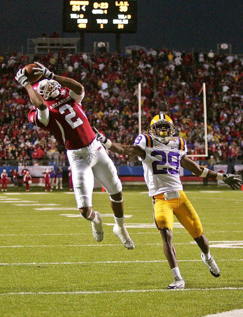 Arkansas receiver London Crawford (2) catches the game-winning pass from quarterback Casey Dick behind LSU’s Chris Hawkins (29), giving the Razorbacks a 31-30 victory over LSU in a game dubbed “Miracle on Markham II” in November 2008.