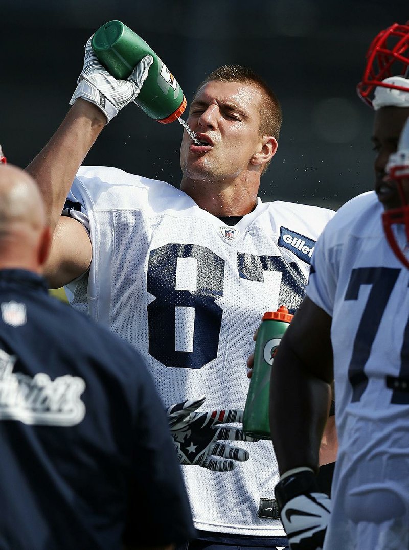 New England tight end Rob Gronkowski gulps water here, but he and some friends ran up a big bar tab at a casino over the weekend.